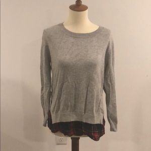 Grey sweater with plaid underlay